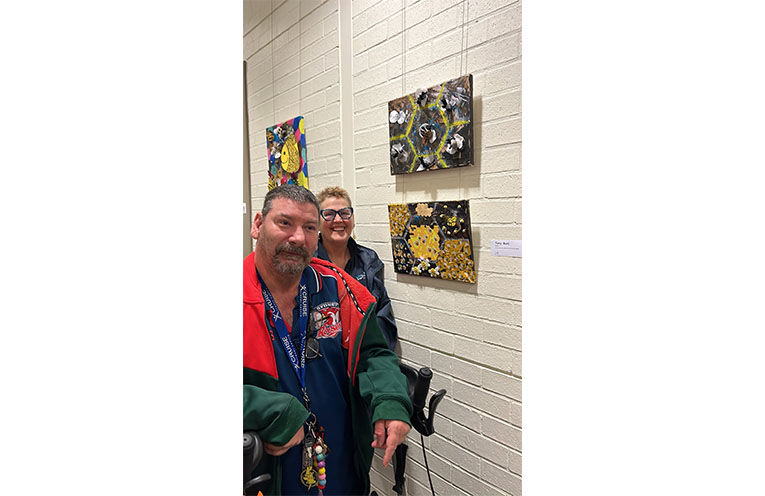 Crafty Queen Cheryl Todd with participant Tony and some of the finished artworks.