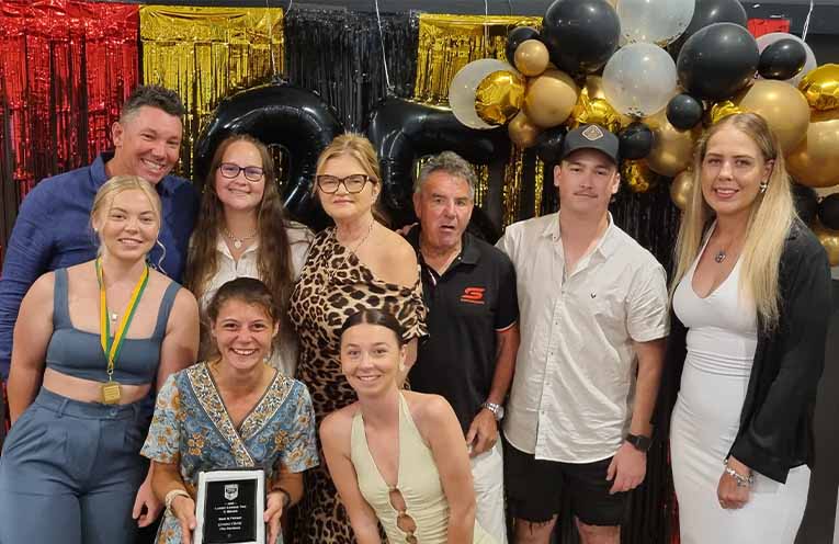 Gemma Clarke (front left) with Lady Hawks players, sponsors and coach at the recent Presentation Night. Photo: Thomas O’Keefe.