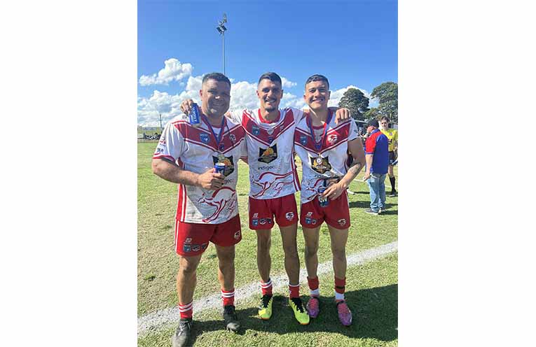 Luke Perry (centre) with long-time teammates Ryan and Shaq Saunders, after the Roos’ big Grand Final win. Photo: supplied.