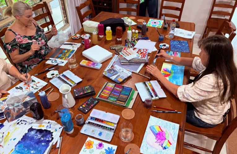 Participants at the Women’s Circle Morning Tea putting the finishing touches on their artworks.