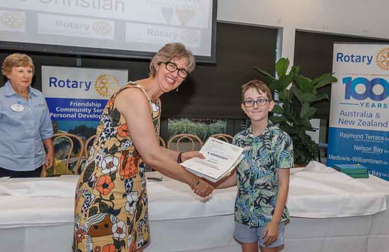 Alison Rogers presenting an award to one of the junior writers. Photo: Henk Tobbe.