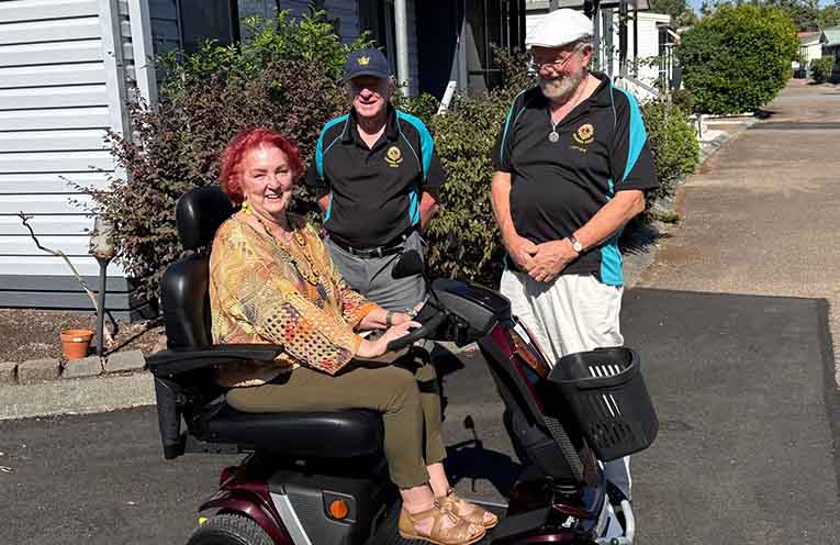 Soldiers Point Lions Club gifts mobility scooter to Anna Bay resident