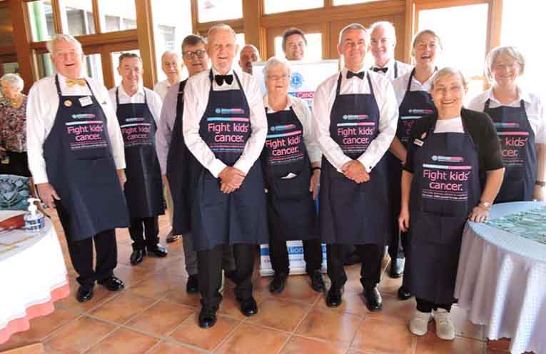 Mr Townsend, front left, with fellow Lions Club members at one of their many charity events. Photo: NOTA file.