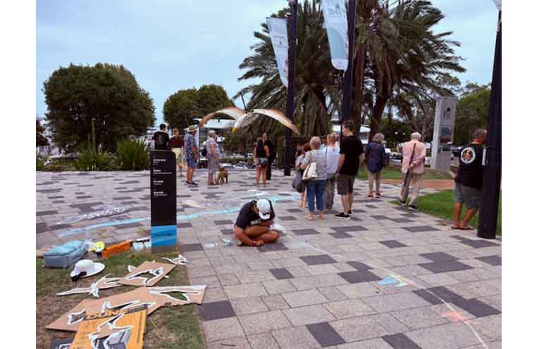 Chalk art and bird mask making at the fair in Apex Park. Photo: Jacie Whitfield.