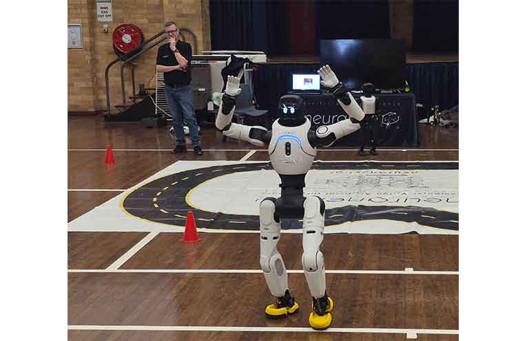 Neuranext founder Adrian Tyson showcasing one of the cutting-edge autonomous humanoid robots. Photo: Nico Lombardo.