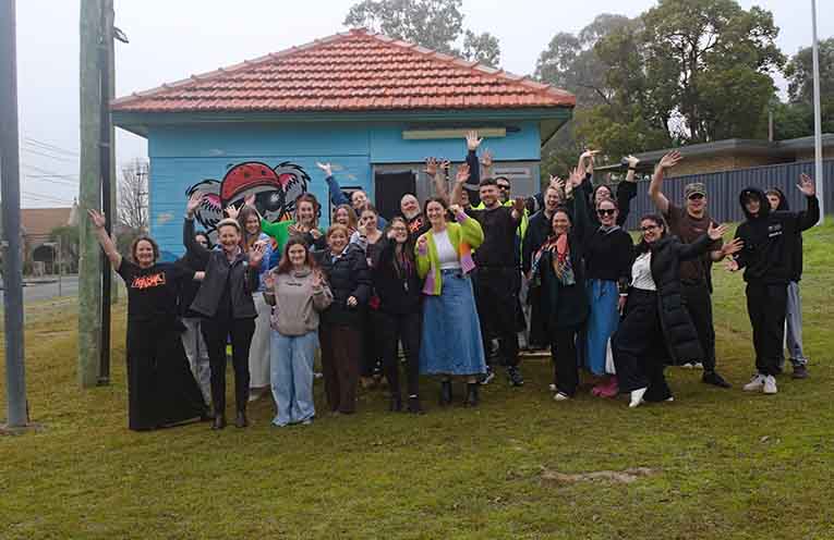 UP&UP staff, students, and project partners posing in front of the mural. Photo: Nico Lombardo.