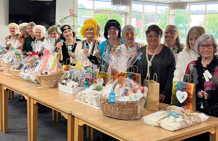 Happy Tombola winners with their prizes at the club’s major fundraiser.