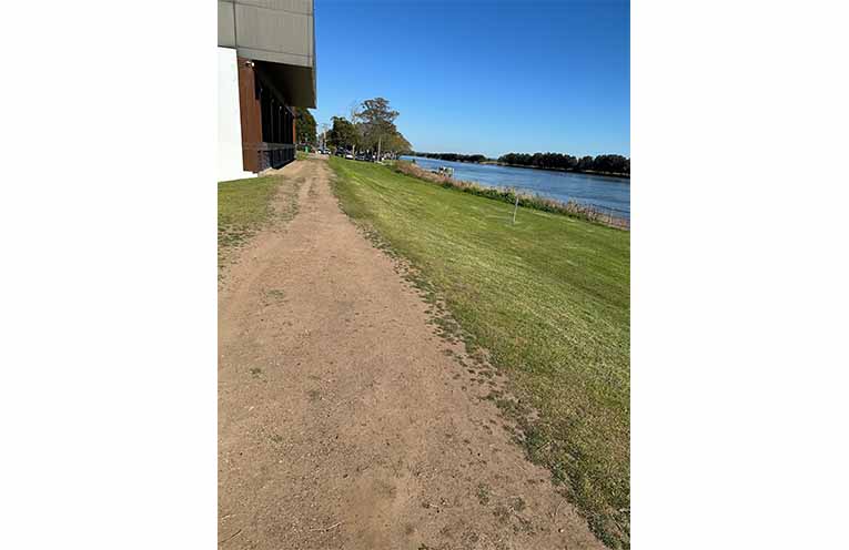 The uneven dirt section of the Raymond Terrace waterfront path that will be paved. Photo: Althea Guinsberg.