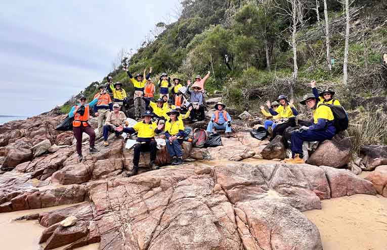 Smile all the way around. A great sense of satisfaction and achievement from the group of volunteers last year. Photo by Friends of Tomaree National Park.