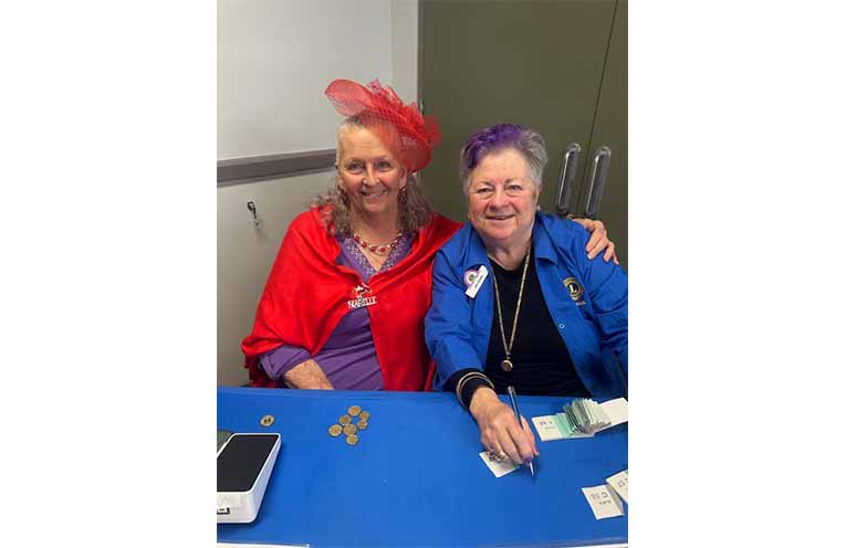 The welcoming committee ready to greet guests at Medowie Lions’ High Tea. Photo: Althea Guinsberg.