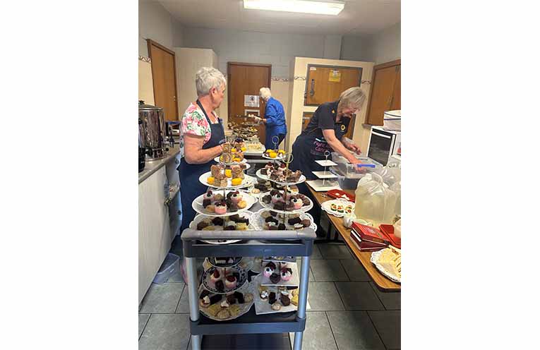 Busy behind the scenes in the kitchen, preparing treats for the High Tea. Photo: Althea Guinsberg.