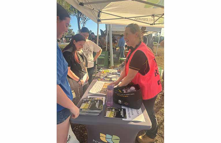 Port Stephens Council Road Safety and Traffic Officer Anna Brown chatting to locals about motorcycle safety. Photo: Althea Guinsberg.
