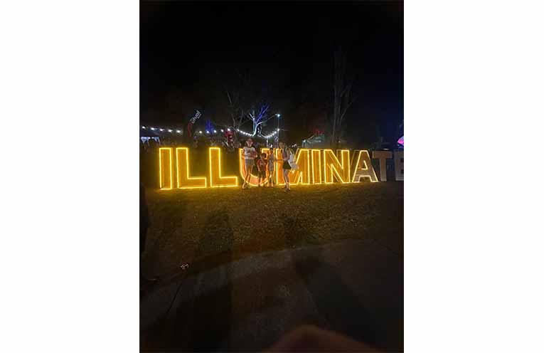 The Illuminate sign is all lit up at night. Photo: Althea Guinsberg.