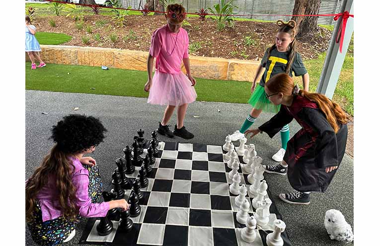 A student puts the outdoor chess area to the test at Irri’s Learning Garden. Photo: Althea Guinsberg.
