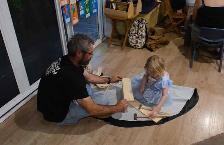Fathers and children bonding together, thanks to woodworking. Photo: Nico Lombardo