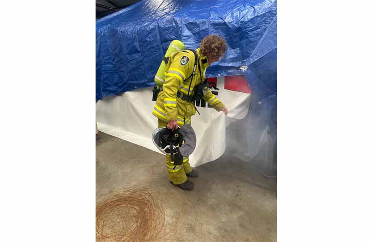 Members of the community had the opportunity to enter the “smoke house” and get an idea of what conditions can be like during a house fire. Photo: Althea Guinsberg.
