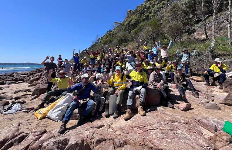 Volunteers gather to cheer another great effort. Photo: Sue Olsson.